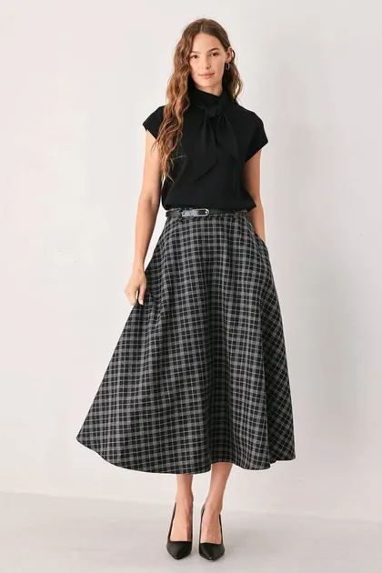 Edit Plaid Midi Skirt — black skirts from Pieces of a Dream
