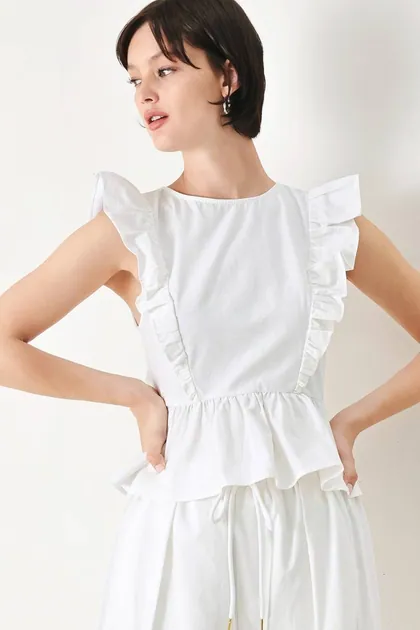 Ruffle Shoulder Cotton Peplum Top — white tops & blouses from Pieces of a Dream
